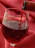 Red wine being poured in a glass